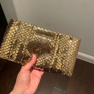 Micheal Kors gold embossed clutch